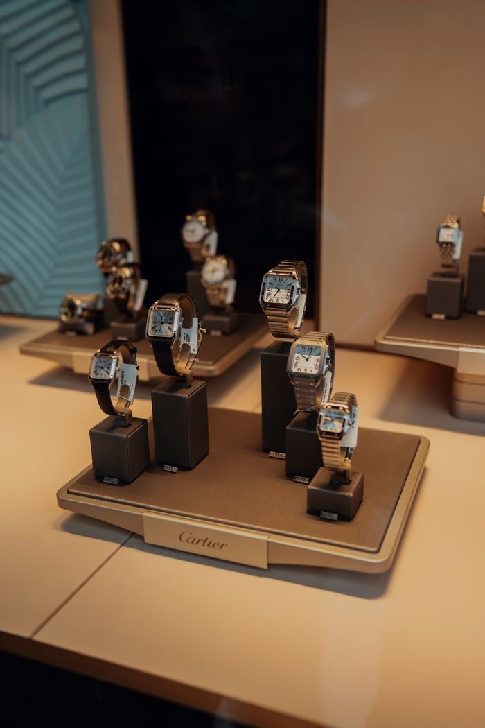 collection-04 Showcase of luxury watches in a stylish retail display in Zermatt, Switzerland.