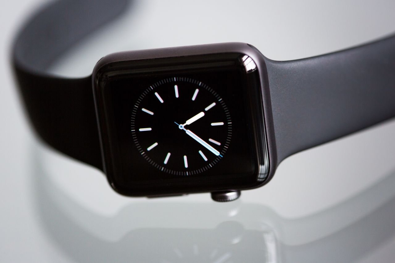 hero-img Close-up of an elegant black smartwatch with a minimalist classic dial on a light background.
