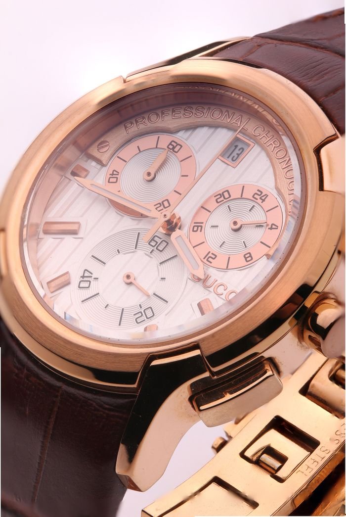 The Art of Drawing Readers In: Your attractive post title goes here Detailed close-up of a luxurious gold chronograph watch with brown leather strap.